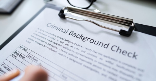 Selective focus photo of a criminal background check form.